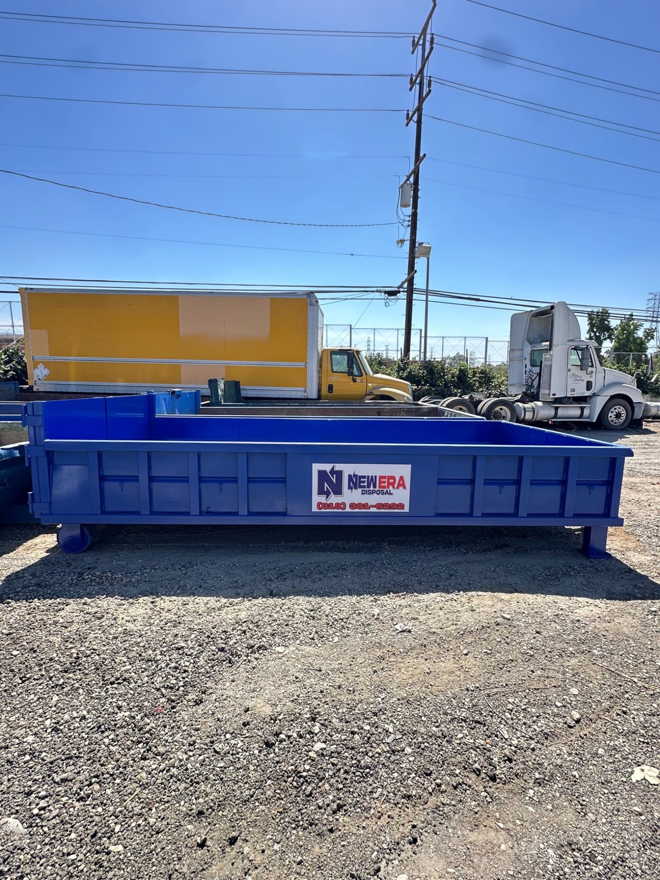New Era Disposal blue roll-off dumpster